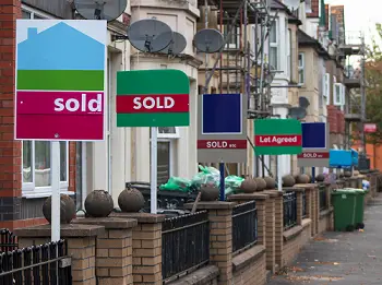 Image of houses with Sold signs